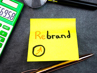 'Rebrand' written on paper'Rebrand' written on paper